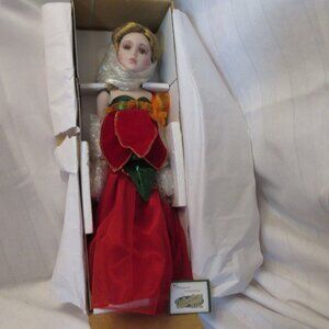 Heritage Signature Poinsettia Porcelain Doll